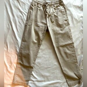 I Love Ugly cargo pants in beige. Size small. Adjustable waist band.